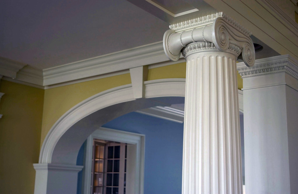 An Ionic Capital atop a Fluted PolyStone® Column in Chadsworth Cottage